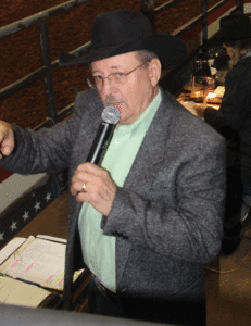 Announcer Jerry Belles, who rode bulls in the first Salem Stampede